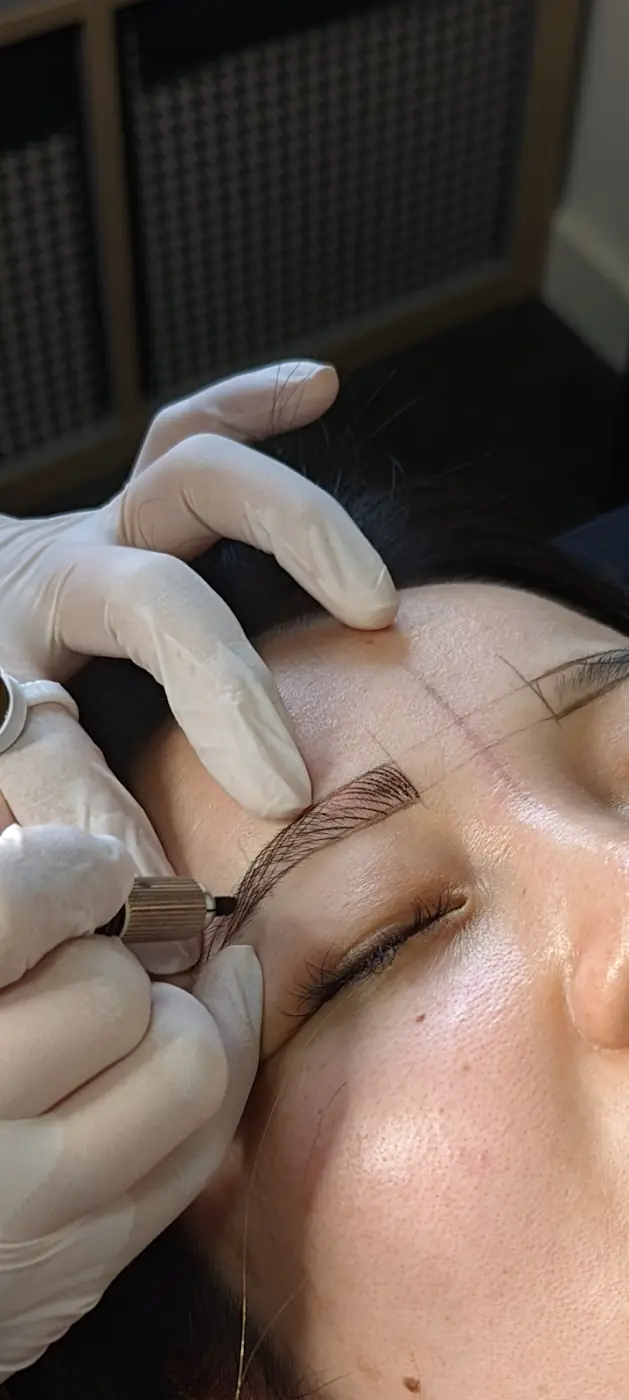 Jenny working on a client's brows at J Advanced Beauty, Chatswood